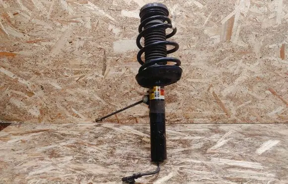 Cadillac XTS Front shock absorber with coil spring 22296966