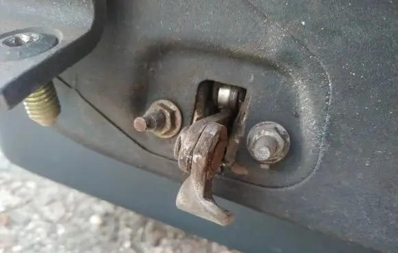 Front door check strap stopper