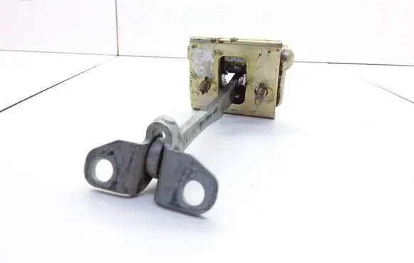 Front door check strap stopper