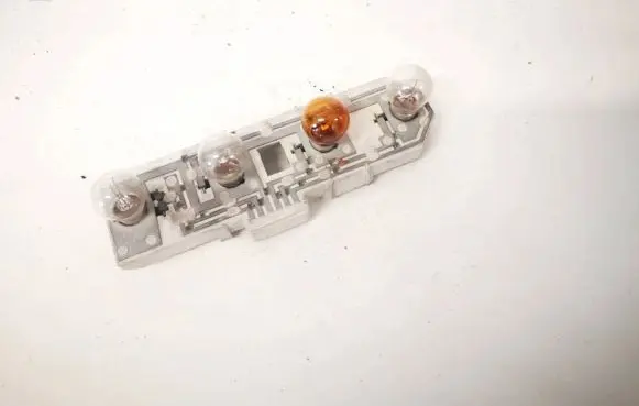 Tail light bulb cover holder