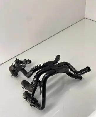 Volkswagen Golf VII Engine coolant pipe/hose 04L121064AM