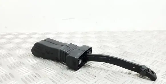 Front door check strap stopper