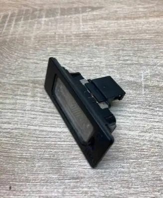 Volkswagen PASSAT B6 Number plate light 8T0943021