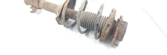 Subaru Impreza I Front shock absorber with coil spring