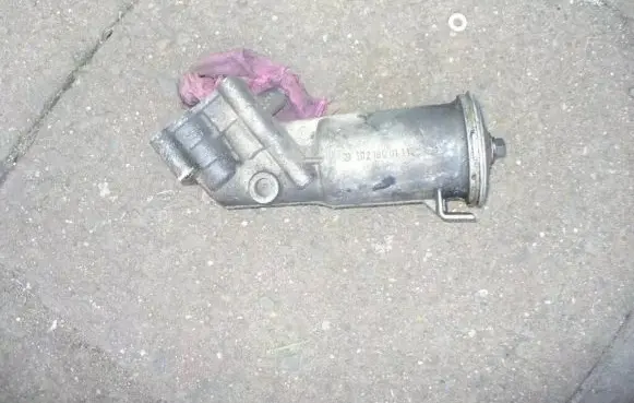 Mercedes-Benz W123 Oil filter mounting bracket 1021800111