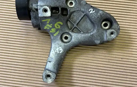 Volkswagen Golf V A/C compressor mount bracket 1K0260885B