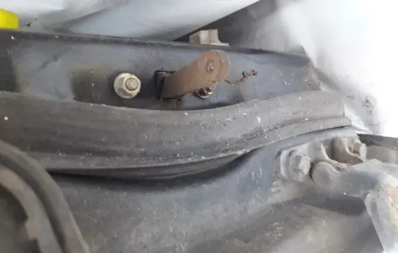 Front door check strap stopper