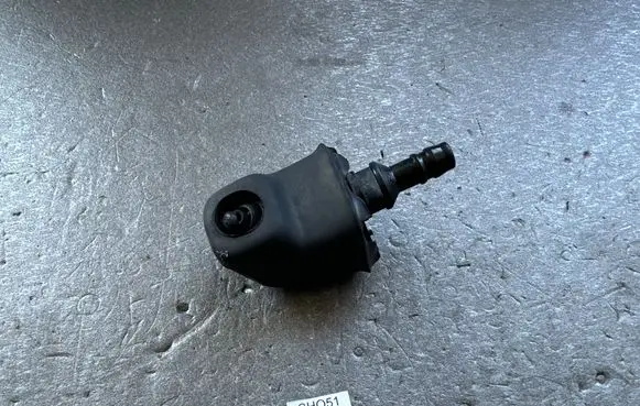 Mitsubishi Pajero Headlight washer nozzle holder MB314757