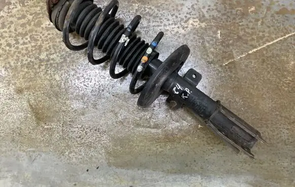 Front shock absorber with coil spring