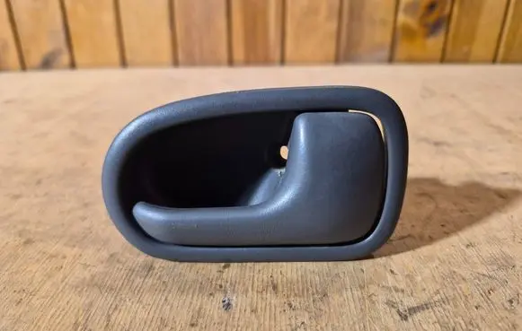Mazda 323 Rear door interior handle DH221