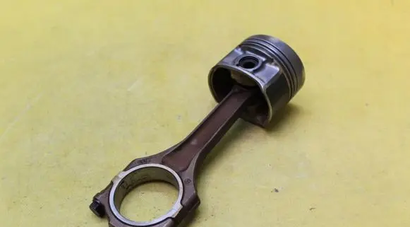 Piston with connecting rod
