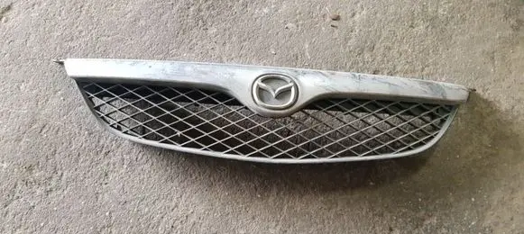 Mazda 626 Front bumper upper radiator grill