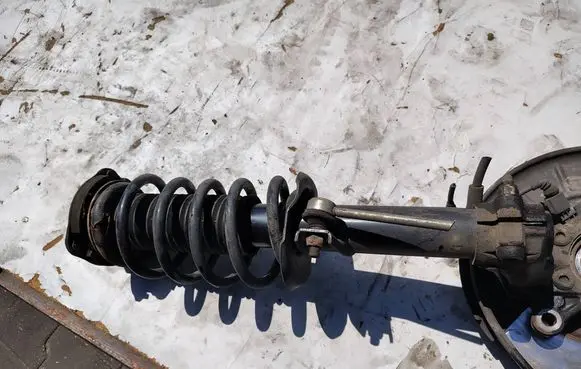 Volkswagen Caddy Front shock absorber with coil spring