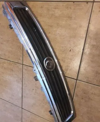 Mazda 626 Front bumper upper radiator grill G51650710