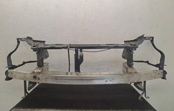 Radiator support slam panel