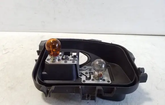 Tail light bulb cover holder