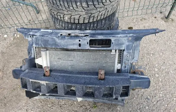 Radiator support slam panel
