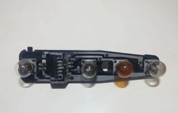 Tail light bulb cover holder