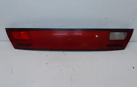 Mazda 323 F Trunk door license plate light bar 0431441