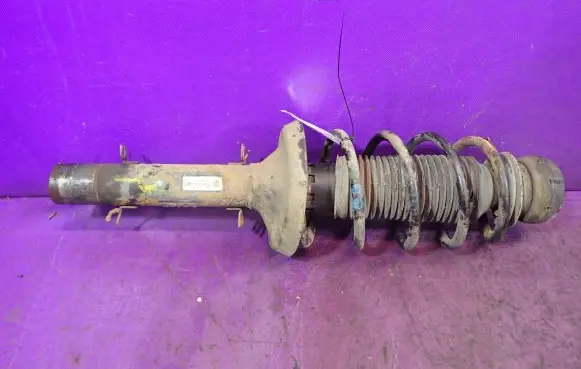 Volkswagen Golf IV Front shock absorber with coil spring 1J0413031S
