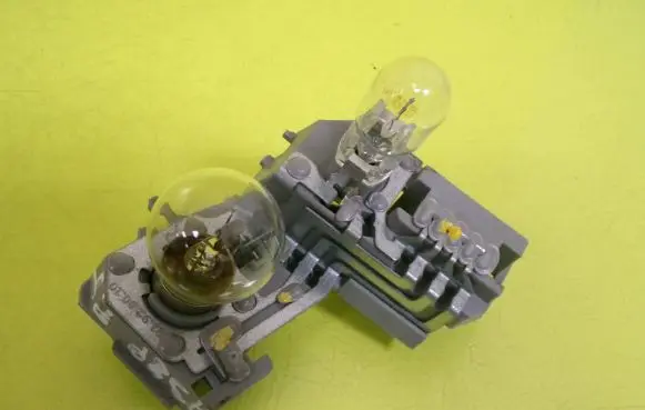 Tail light bulb cover holder