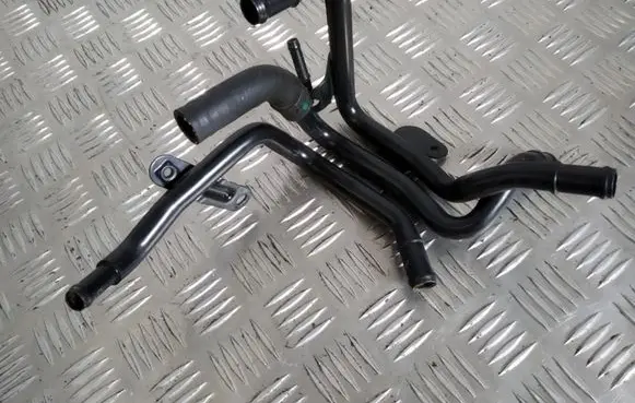 Volkswagen Golf VII Engine coolant pipe/hose 04L121064AD