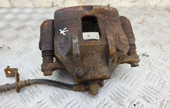 KIA Carens III Front brake caliper 