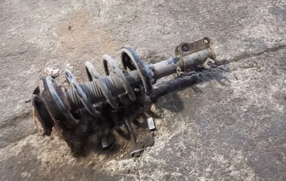 KIA Carnival Front shock absorber with coil spring