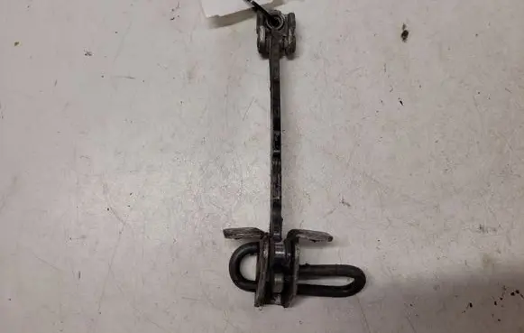 Front door check strap stopper