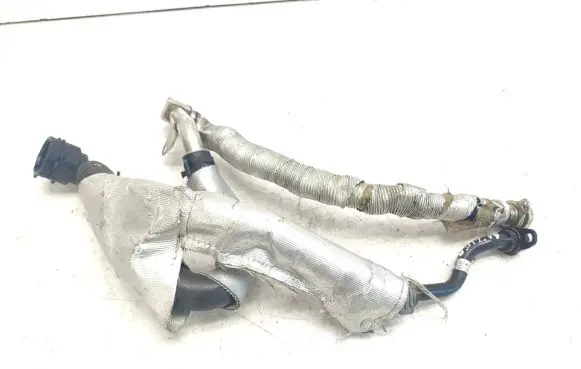 Volkswagen Golf VII Engine coolant pipe/hose 06K121065R