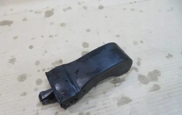 Front door check strap stopper