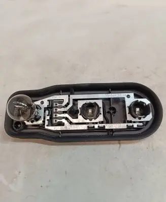 Tail light bulb cover holder