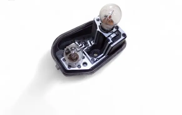 Tail light bulb cover holder