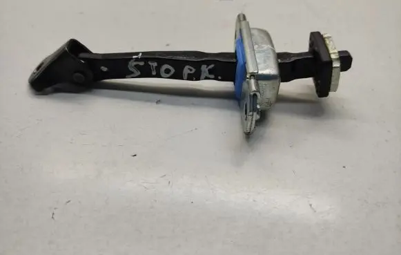 Front door check strap stopper