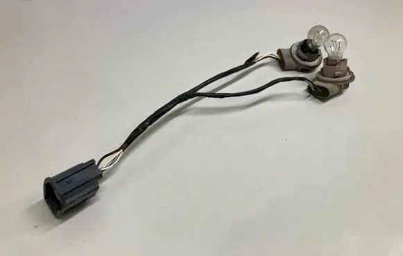 Jeep Patriot Tail light bulb cover holder 1T57054