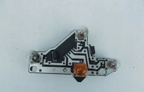 Tail light bulb cover holder