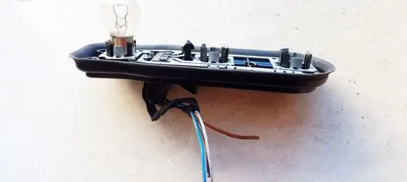 Tail light bulb cover holder