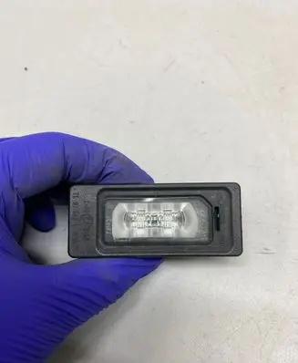 Porsche Cayenne (92A) Number plate light 010998