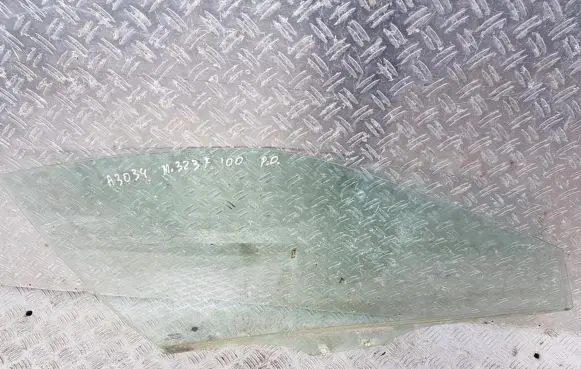 Mazda 323 F Front door window glass four-door