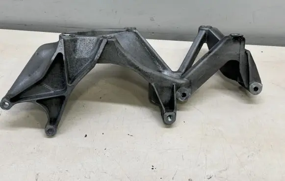 Porsche Cayenne (92A) A/C compressor mount bracket 03H260087E