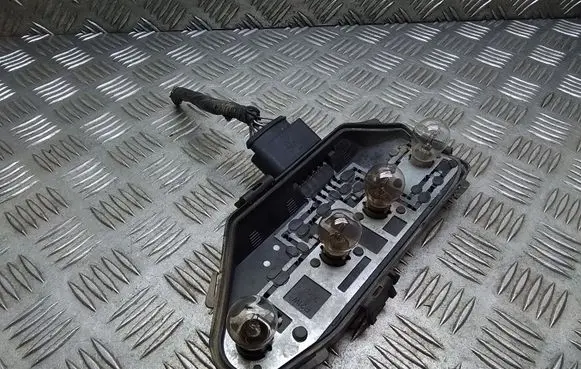 Tail light bulb cover holder