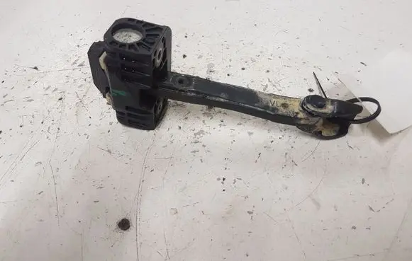 Front door check strap stopper