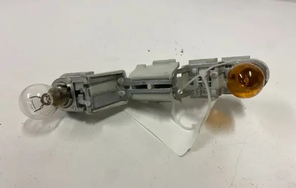 Volvo V50 Tail light bulb cover holder