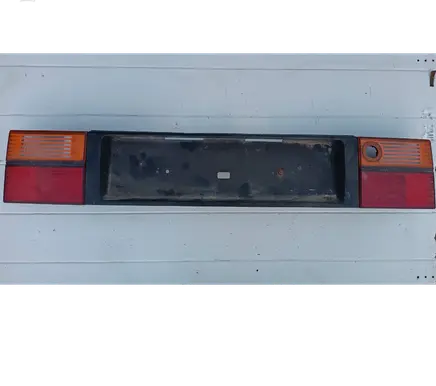 Trunk door license plate light bar
