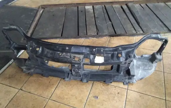 Radiator support slam panel