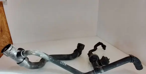 Volkswagen PASSAT B5 Engine coolant pipe/hose 4A0819809