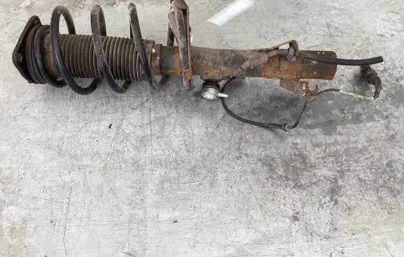 Front shock absorber with coil spring