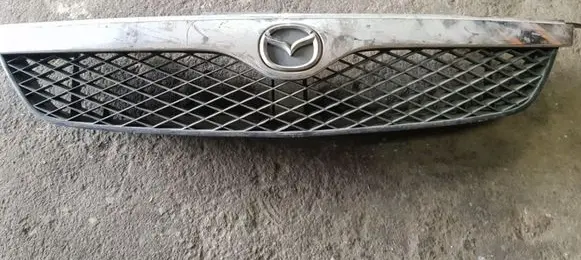 Mazda 626 Front bumper upper radiator grill