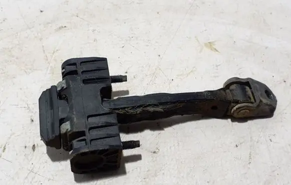 Front door check strap stopper