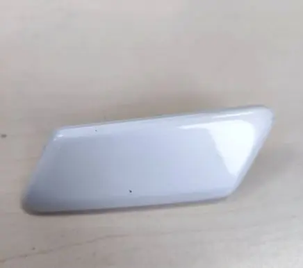 Headlight washer spray nozzle cap/cover